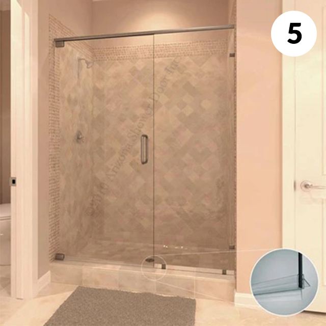 Frameless glass shower enclosure